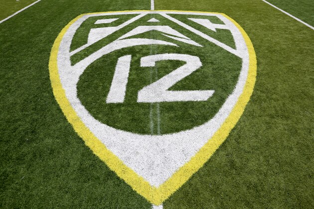 A PAC-12 logo is seen painted on the field before an NCAA college football game between Washington State and Oregon Saturday, Oct. 10, 2015, in Eugene, Ore. (AP Photo/Ryan Kang)
