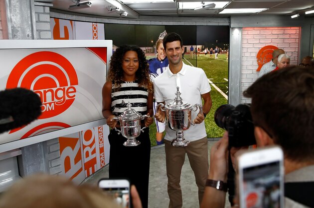 NEW YORK, NY - SEPTEMBER 10:  Novak Djokovic of Serbia and Naomi Osaka of Japan hold their winners trophies at NBC's TODAY Show on September 10, 2018 in New York City.  (Photo by Julian Finney/Getty Images)