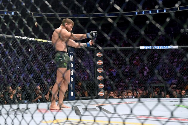 LAS VEGAS, NV - OCTOBER 06:  Conor McGregor makes a gesture toward Khabib Nurmagomedov before their match in UFC 229 on October 6, 2018 in Las Vegas, Nevada.  (Photo by Harry How/Getty Images)