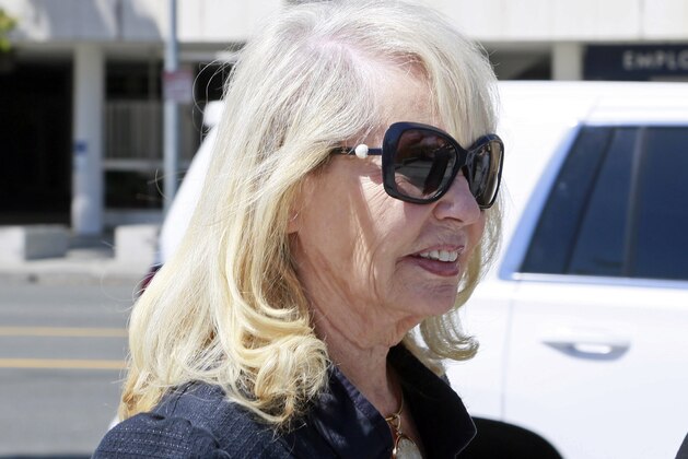 Shelly Sterling, estranged wife of former Los Angeles Clippers basketball team owner Donald Sterling, leaves for the lunch break during her lawsuit against her husband's mistress in Los Angeles Superior Court Wednesday, March 25, 2015. Sterling's lawyer says V. Stiviano manipulated and deceived Donald Sterling out of more than $3.5 million. Stiviano's lawyer, Mac Nehoray, says Sterling gave the gifts when he was separated from his wife, Shelly Sterling, and that no real community property was transferred to his client. (AP Photo/Nick Ut)