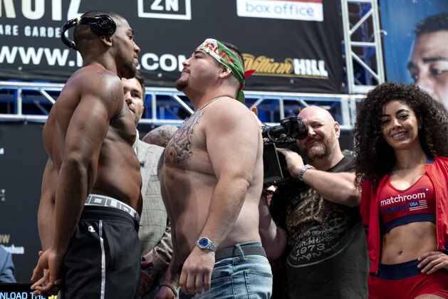 Heavyweight boxers Anthony Joshua, left, and Andy Ruiz Jr. face off during a weigh-in at Madison Square Garden, Friday, May 31, 2019, before their title bout Saturday in New York. (AP Photo/Craig Ruttle)