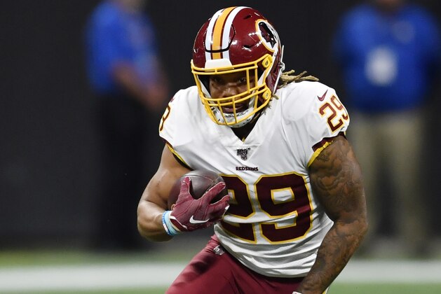 Washington Redskins running back Derrius Guice (29) runs against the Atlanta Falcons during the first half an NFL preseason football game, Thursday, Aug. 22, 2019, in Atlanta. (AP Photo/Mike Stewart)