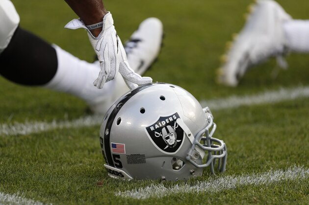 An Oakland Raiders helmet is shown  before an NFL preseason football game against the Green Bay Packers in Green Bay, Wis., Thursday, Aug. 18, 2016. (AP Photo/Matt Ludtke)