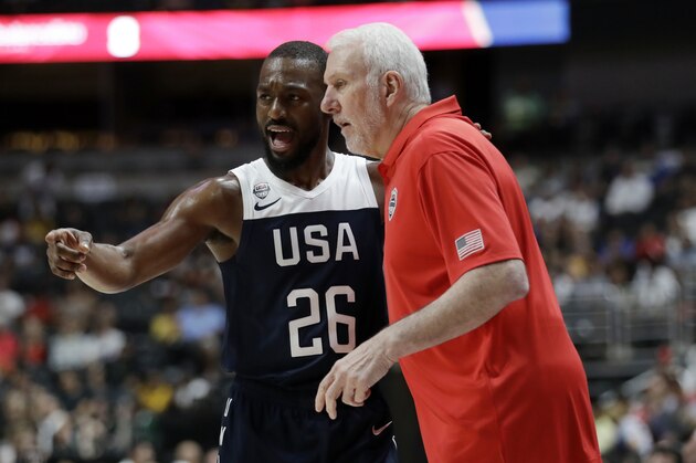 United States' Kemba Walker, left, talks to  coach Gregg Popovich during the first half of the team's exhibition basketball game against Spain on Friday, Aug. 16, 2019, in Anaheim, Calif. (AP Photo/Marcio Jose Sanchez)
