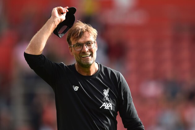 Liverpool's German manager Jurgen Klopp celebrates on the pitch on the final whistle in the English Premier League football match between Southampton and Liverpool at St Mary's Stadium in Southampton, southern England on August 17, 2019. - Liverpool won the game 2-1. (Photo by Glyn KIRK / AFP) / RESTRICTED TO EDITORIAL USE. No use with unauthorized audio, video, data, fixture lists, club/league logos or 'live' services. Online in-match use limited to 120 images. An additional 40 images may be used in extra time. No video emulation. Social media in-match use limited to 120 images. An additional 40 images may be used in extra time. No use in betting publications, games or single club/league/player publications. /         (Photo credit should read GLYN KIRK/AFP/Getty Images)