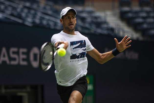 NEW YORK, NEW YORK - AUGUST 21: Novak Djokovic of Serbia practices with Stan Wawrinka of Switzerland before the US Open at USTA Billie Jean King National Tennis Center on August 21, 2019 in New York City. (Photo by TPN/Getty Images)