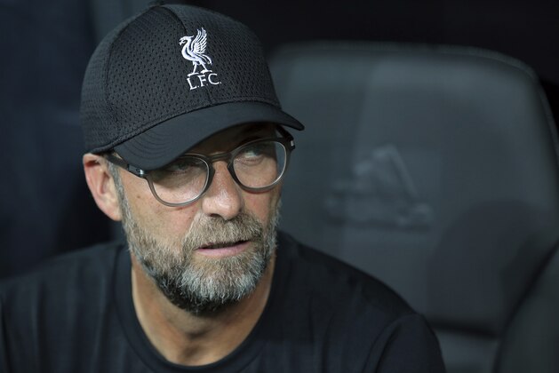 Liverpool's manager Jurgen Klopp looks out from the bench before the UEFA Super Cup soccer match between Liverpool and Chelsea, in Besiktas Park, in Istanbul, Wednesday, Aug. 14, 2019. (AP Photo)