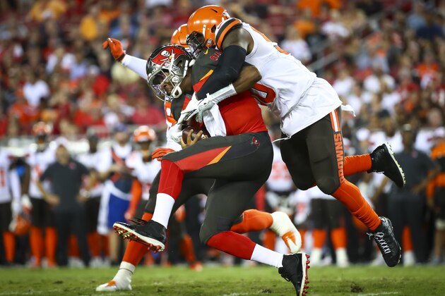 TAMPA, FL - AUGUST 23: Jameis Winston #3 of the Tampa Bay Buccaneers sacked by Chris Smith #50 of the Cleveland Browns in the second quarter of the preseason game at Raymond James Stadium on August 23, 2019 in Tampa, Florida. (Photo by Will Vragovic/Getty Images)