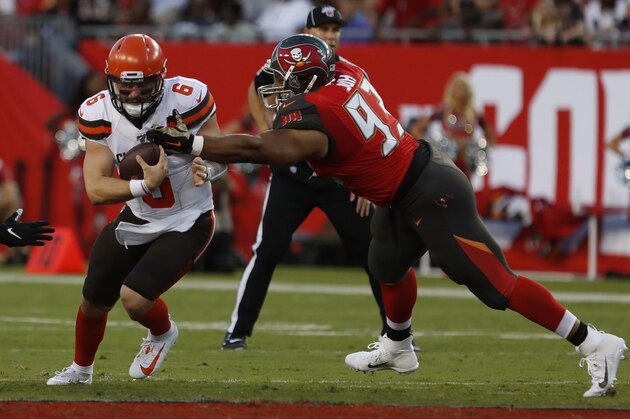 Cleveland Browns quarterback Baker Mayfield (6) escapes a tackle by Tampa Bay Buccaneers nose tackle Ndamukong Suh (93) during the first half of an NFL preseason football game Friday, Aug. 23, 2019, in Tampa, Fla. (AP Photo/Mark LoMoglio)