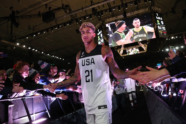 MELBOURNE, AUS - AUGUST 22: Kyle Kuzma #21 of Team USA high-fives fans on the way to the court before the game against the Australia Boomers on August 22, 2019 at Marvel Stadium in Melbourne, Australia. NOTE TO USER: User expressly acknowledges and agrees that, by downloading and/or using this photograph, user is consenting to the terms and conditions of the Getty Images License Agreement. Mandatory Copyright Notice: Copyright 2019 NBAE  (Photo by Joe Murphy/NBAE via Getty Images)