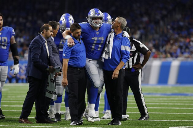 Detroit Lions offensive guard Frank Ragnow (77) is helped off the field by medical staff in the first half of an NFL preseason football game against the Buffalo Bills in Detroit, Friday, Aug. 23, 2019. (AP Photo/Rick Osentoski)