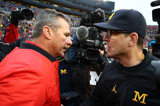 ANN ARBOR, MI - NOVEMBER 25:  Urban Meyer head coach of the Ohio State Buckeyes and Jim Harbaugh head coach of the Michigan Wolverines shake hands after the game. Ohio State won 31 to 20 on November 25, 2017 at Michigan Stadium in Ann Arbor, Michigan. (Photo by Gregory Shamus/Getty Images)