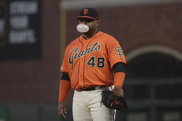 San Francisco Giants' Pablo Sandoval blows a bubble as he stands at first base during a baseball game against the Milwaukee Brewers in San Francisco, Friday, June 14, 2019. (AP Photo/Jeff Chiu)