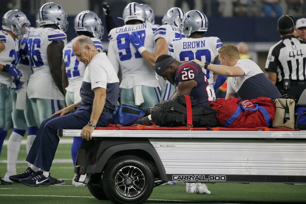 Houston Texans running back Lamar Miller (26) is carted off the field after suffering an unknown injury in the first half of a preseason NFL football game against the Dallas Cowboys in Arlington, Texas, Saturday, Aug. 24, 2019. (AP Photo/Michael Ainsworth)