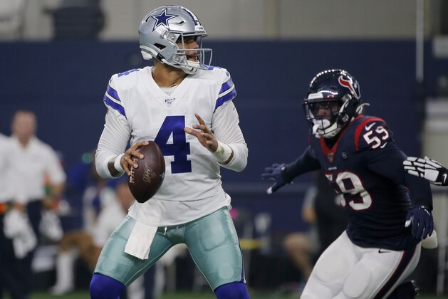 Dallas Cowboys' Dak Prescott (4) prepares to throw a pass as Houston Texans' Whitney Mercilus (59) pressures in the first half of a preseason NFL football game in Arlington, Texas, Saturday, Aug. 24, 2019. (AP Photo/Michael Ainsworth)