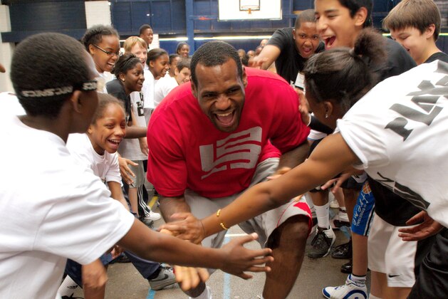 LONDON - SEPTEMBER 05:  Lebron James #23 of the Cleveland Cavaliers talks to children during the Nike Lebron James Tour as he launches the New Basketball Legacy on September 5, 2009 in London, England.  (Photo by Marco Secchi/Getty Images)