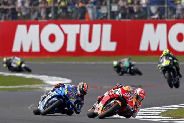 Repsol Honda Team's Spanish rider Marc Marquez (2nd R) leads from Suzuki Ecstar's Spanish rider Alex Rins (2nd L) during the Moto GP race of the British Grand Prix at Silverstone circuit in Northamptonshire, central England, on August 25, 2019. (Photo by Adrian DENNIS / AFP)        (Photo credit should read ADRIAN DENNIS/AFP/Getty Images)