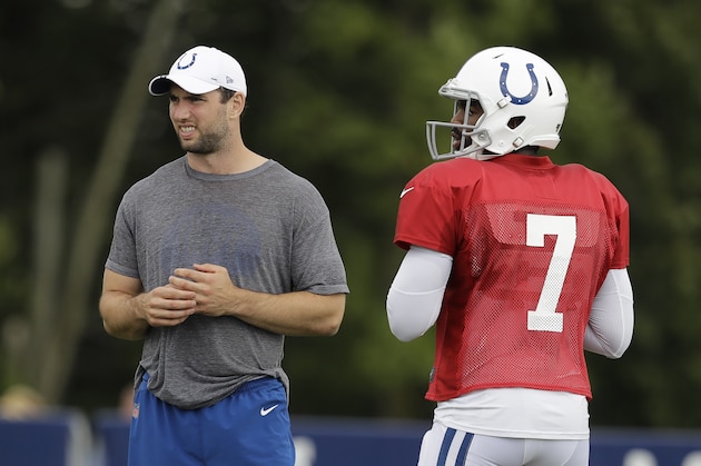 Indianapolis Colts quarterback Andrew Luck watches as quarterback Jacoby Brissett (7) throws during practice at the NFL team's football training camp in Wednesday, Aug. 14, 2019, in Westfield, Ind. (AP Photo/Darron Cummings)