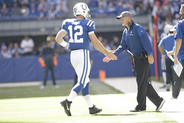 Indianapolis Colts head coach Chuck Pagano congratulates Indianapolis Colts quarterback Andrew Luck (12) after a touchdown against the Chicago Bears during the first half of an NFL football game in Indianapolis, Sunday, Oct. 9, 2016. (AP Photo/AJ Mast)