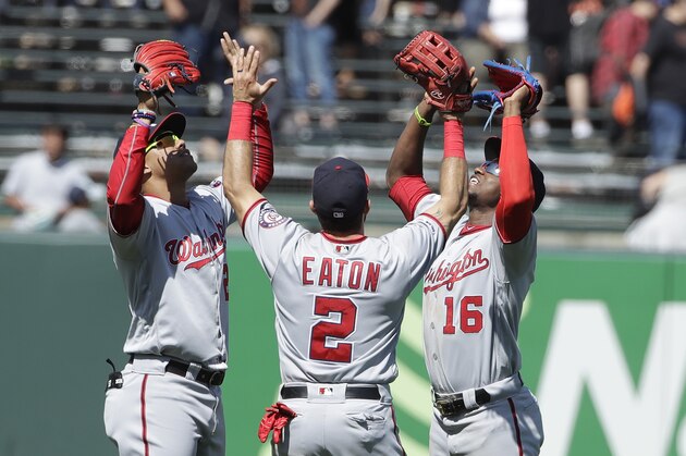 Washington Nationals' Juan Soto, from left, celebrates with Adam Eaton and Victor Robles after the Nationals defeated the San Francisco Giants in a baseball game in San Francisco, Wednesday, Aug. 7, 2019. (AP Photo/Jeff Chiu)