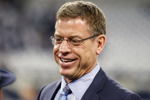 FILE - In this Sunday, Jan. 15, 2017 file photo, Troy Aikman watches warm ups before an NFL divisional playoff football game between the Green Bay Packers and the Dallas Cowboys in Arlington, Texas. Thursday night football is here to stay, even if it's gone for the rest of 2018.  In past years, some make that many would have said