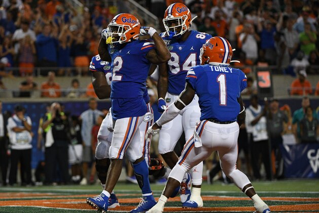 ORLANDO, FL - AUGUST 24: Lamical Perine #2 of the Florida Gators celebrates scoring a touchdown with teammates in the second half against the Miami Hurricanes in the Camping World Kickoff at Camping World Stadium on August 24, 2019 in Orlando, Florida.(Photo by Mark Brown/Getty Images)