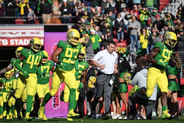 SANTA CLARA, CA - DECEMBER 31:  Head coach Mario Cristobal of the Oregon Ducks runs onto the field prior to the start of the Redbox Bowl against the Michigan State Spartans at Levi's Stadium on December 31, 2018 in Santa Clara, California.  (Photo by Thearon W. Henderson/Getty Images)