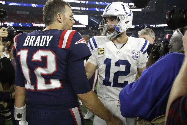 New England Patriots quarterback Tom Brady, left, and Indianapolis Colts quarterback Andrew Luck speak at midfield after an NFL football game, Thursday, Oct. 4, 2018, in Foxborough, Mass. (AP Photo/Charles Krupa)