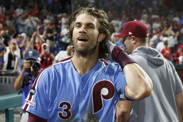 Philadelphia Phillies' Bryce Harper reacts to his grand slam following the ninth inning of a baseball game against the Chicago Cubs, Thursday, Aug. 15, 2019, in Philadelphia. The Phillies won 7-5. (AP Photo/Chris Szagola)