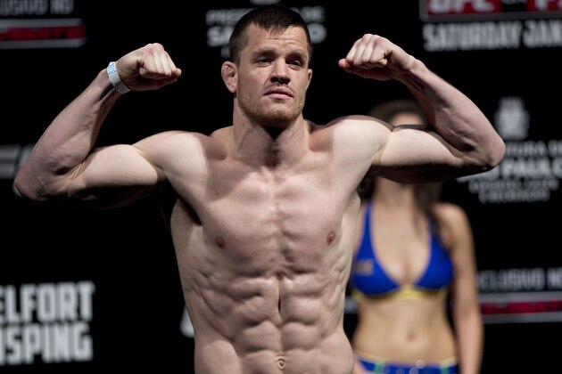 Fighter C.B. Dollaway from the US gestures as he weighs in ahead of the Ultimate Fighting Championship, UFC, in Sao Paulo, Brazil, Friday, Jan. 18, 2013. Dollaway will compete in the UFC in Sao Paulo on Jan. 19. (AP Photo/Andre Penner)