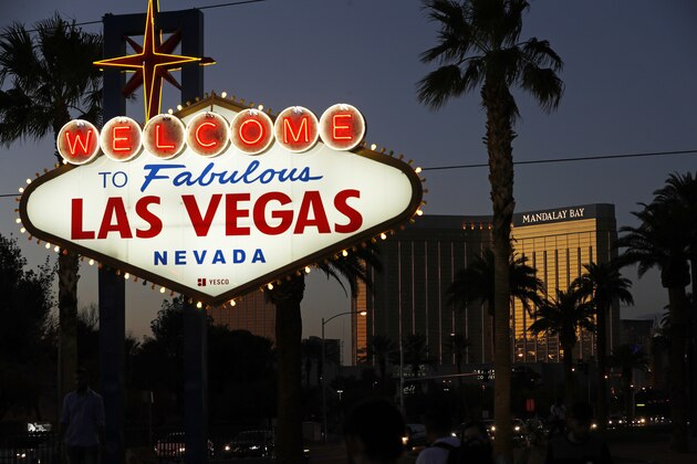 FILE - In this Sept. 21, 2018, file photo, the Mandalay Bay hotel and casino reflects the last sunlight of the day along the Las Vegas Strip in Nevada. The hotel was the scene of the the worst mass shooting in modern U.S. history. President Donald Trump is