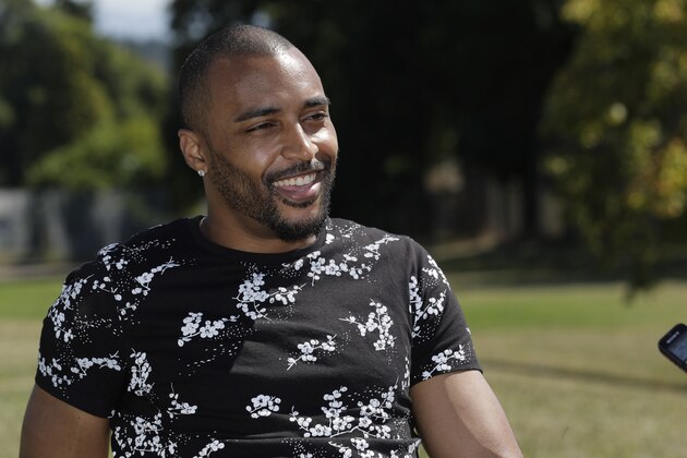 Former NFL football Seattle Seahawks wide receiver Doug Baldwin takes part in an interview Monday, Aug. 26, 2019, at the location in Renton, Wash. where he hopes to spearhead the construction of a community center. Baldwin is donating $1 million toward the project with the goal of raising another $5 million in collaboration with the city of Renton. Baldwin was released by the Seahawks in early May with a failed physical designation after an offseason where he underwent surgeries on his groin, shoulder and knee. (AP Photo/Ted S. Warren)
