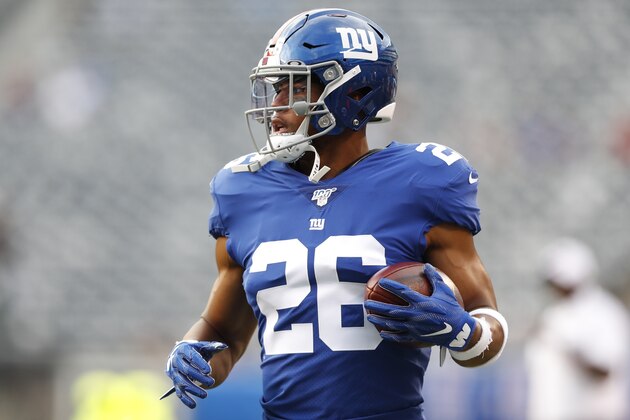 New York Giants running back Saquon Barkley warms up before a preseason NFL football game against the New York Jets Thursday, Aug. 8, 2019, in East Rutherford, N.J. (AP Photo/Michael Owens)