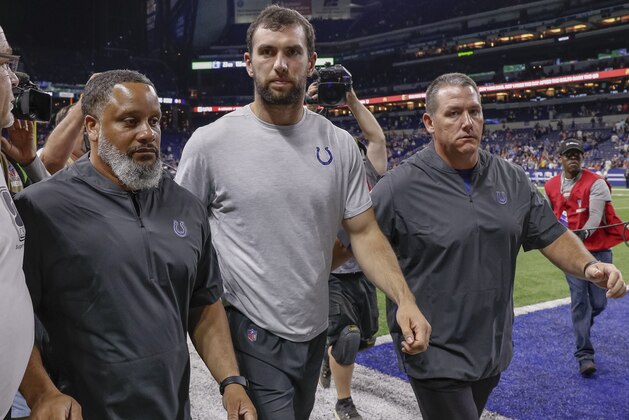 INDIANAPOLIS, IN - AUGUST 24: Andrew Luck #12 of the Indianapolis Colts walks off the field following reports of his retirement from the NFL after the preseason game against the Chicago Bears at Lucas Oil Stadium on August 24, 2019 in Indianapolis, Indiana. (Photo by Michael Hickey/Getty Images)