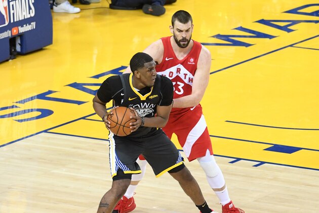 OAKLAND, CA - JUNE 13: Kevon Looney #5 of the Golden State Warriors posts up on Marc Gasol #33 of the Toronto Raptors during Game Six of the NBA Finals on June 13, 2019 at ORACLE Arena in Oakland, California. NOTE TO USER: User expressly acknowledges and agrees that, by downloading and/or using this photograph, user is consenting to the terms and conditions of Getty Images License Agreement. Mandatory Copyright Notice: Copyright 2019 NBAE (Photo by Noah Graham/NBAE via Getty Images)