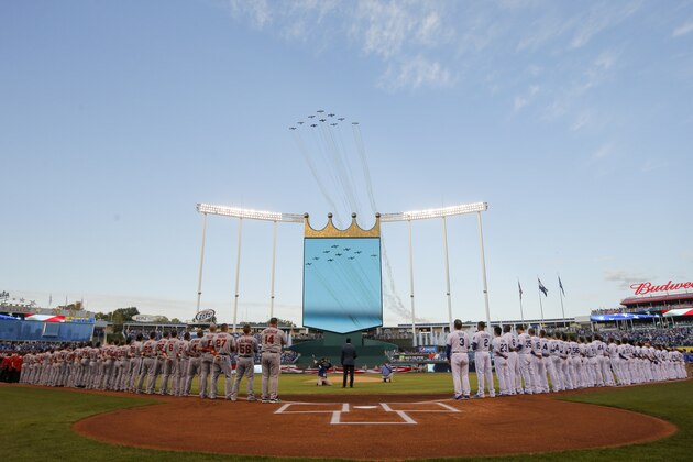 Airplanes fly over Kaufmann Stadium during the singing of the Star Spangled Banner before Game 3 of baseball's AL Division Series between the Kansas City Royals and the Los Angeles Angels in Kansas City, Mo., Sunday, Oct. 5, 2014. (AP Photo/Travis Heying)