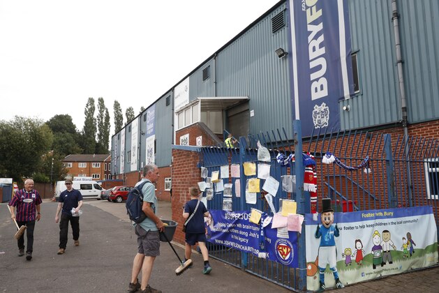 A general view of Gigg Lane stadium, home of Bury Football Club, as volunteers help clean up the stadium in Bury, England, Tuesday, Aug. 27, 2019. Bury FC are almost certain to be expelled from the third tier of English soccer after a proposed takeover by C&N Sporting Risk fell through on Tuesday, just 90 minutes before a league-set deadline for the deal to be completed. The League One club's owner Steve Dale was originally given until midnight on Friday to prove he could pay off Bury's debts and fund the next two seasons or find someone who could. (AP Photo/Alastair Grant)