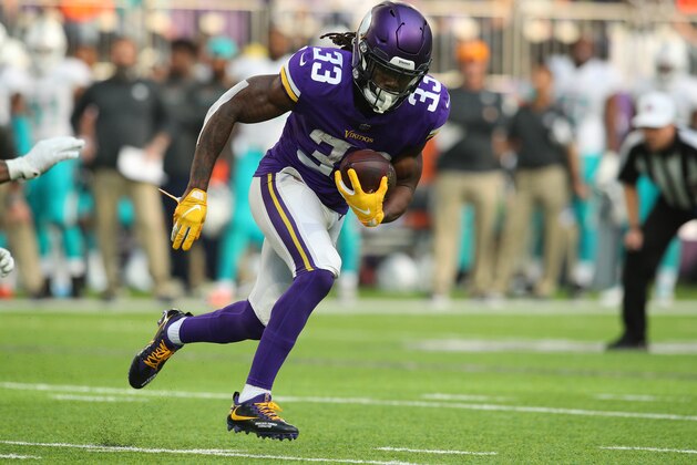 MINNEAPOLIS, MN - DECEMBER 16: Dalvin Cook #33 of the Minnesota Vikings carries the ball in the first quarter of the game against the Miami Dolphins at U.S. Bank Stadium on December 16, 2018 in Minneapolis, Minnesota. (Photo by Adam Bettcher/Getty Images)