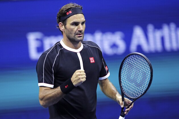 Roger Federer pumps his fist after defeating Sumit Nagal during the first round of the U.S. Open tennis tournament in New York, Monday, Aug. 26, 2019. Federer won 4-6, 6-1, 6-1, 6-4. (AP Photo/Charles Krupa)