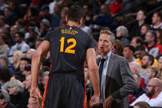 PORTLAND, OR - FEBRUARY 19: Andrew Bogut #12 talks to Steve Kerr of the Golden State Warriors during the game against the Portland Trail Blazers on February 19, 2016 at the Moda Center in Portland, Oregon. NOTE TO USER: User expressly acknowledges and agrees that, by downloading and or using this Photograph, user is consenting to the terms and conditions of the Getty Images License Agreement. Mandatory Copyright Notice: Copyright 2016 NBAE (Photo by Sam Forencich/NBAE via Getty Images)