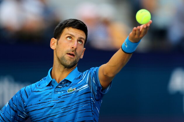 NEW YORK, NEW YORK - AUGUST 26:  Novak Djokovic of Serbia serves during his men's singles first round match against Roberto Carballes Baena of Spain during day one of the 2019 US Open at the USTA Billie Jean King National Tennis Center on August 26, 2019 in the Flushing neighborhood of the Queens borough of New York City.  (Photo by Elsa/Getty Images)