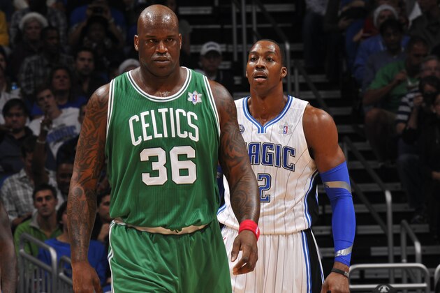 ORLANDO, FL - DECEMBER 25:  Dwight Howard #12 of the Orlando Magic keeps his eyes on Shaquille O'Neal #36 of the Boston Celtics on December 25, 2010 at the Amway Center in Orlando, Florida. NOTE TO USER: User expressly acknowledges and agrees that, by downloading and or using this photograph, User is consenting to the terms and conditions of the Getty Images License Agreement. Mandatory Copyright Notice: Copyright 2010 NBAE  (Photo by Fernando Medina/NBAE via Getty Images)