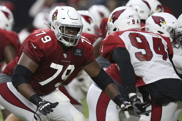 Arizona Cardinals offensive tackle Korey Cunningham (79) looks to make a block on Cardinals linebacker Cameron Malveaux (94) during an NFL football training camp practice Wednesday, July 31, 2019, in Glendale, Ariz. (AP Photo/Ross D. Franklin)