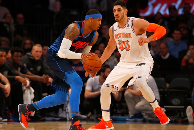 NEW YORK, NY - DECEMBER 16:  (NEW YORK DAILIES OUT)    Carmelo Anthony #7 of the Oklahoma City Thunder in action against Enes Kanter #00 of the New York Knicks at Madison Square Garden on December 16, 2017 in New York City. The Knicks defeated the Thunder 111-96. NOTE TO USER: User expressly acknowledges and agrees that, by downloading and/or using this Photograph, user is consenting to the terms and conditions of the Getty Images License Agreement.  (Photo by Jim McIsaac/Getty Images)