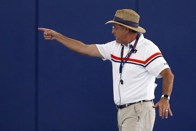 Coach Gus Malzahn gives some instruction to players during Auburn's first practice, Friday, Aug. 2, 2019, in Auburn, Ala. (AP Photo/Butch Dill)