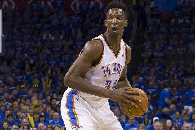 OKLAHOMA CITY, OK - May 25: Hasheem Thabeet #34 of the Oklahoma City Thunder handles the ball against the San Antonio Spurs in Game 3 of the Western Conference Finals during the 2014 NBA Playoffs at the Chesapeake Arena on May 25, 2014 in Oklahoma City, Oklahoma. NOTE TO USER:  User expressly acknowledges and agrees that, by downloading and/or using this photograph, user is consenting to the terms and conditions of the Getty Images License Agreement. Mandatory Copyright Notice:  Copyright 2014 NBAE (Photo by Richard Rowe/NBAE via Getty Images)