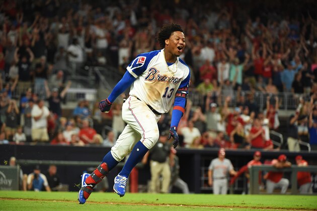 ATLANTA, GEORGIA - AUGUST 03: Ronald Acuna Jr. #13 of the Atlanta Braves celebrates after hitting a walk off run in the 10th inning against the Cincinnati Reds at SunTrust Park on August 03, 2019 in Atlanta, Georgia. (Photo by Logan Riely/Getty Images)