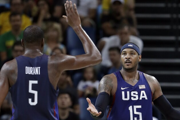 United States’ Carmelo Anthony (15) celebrates with teammate Kevin Durant (5) during a men's semifinal round basketball game against Spain at the 2016 Summer Olympics in Rio de Janeiro, Brazil, Friday, Aug. 19, 2016. (AP Photo/Eric Gay)