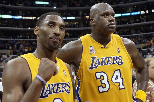 FILE - In this May 4, 2002, file photo, Los Angeles Lakers' Kobe Bryant, left, and Shaquille O'Neal celebrate after winning Game 5 of the Western Conference semifinals against the San Antonio Spurs, in Los Angeles. Bryant downplayed talk of a reignited feud with Shaquille O'Neal, saying there is