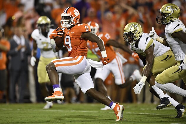 CLEMSON, SOUTH CAROLINA - AUGUST 29: Running back Travis Etienne #9 of the Clemson Tigers rushes for a touchdown during the second quarter of the Tigers' football game against the Georgia Tech Yellow Jackets at Memorial Stadium on August 29, 2019 in Clemson, South Carolina. (Photo by Mike Comer/Getty Images)